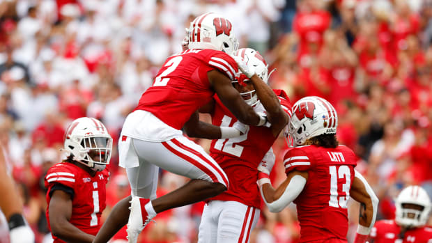 Wisconsin cornerbacks Ricardo Hallman and Max Lofy celebrate an interception against Washington State
